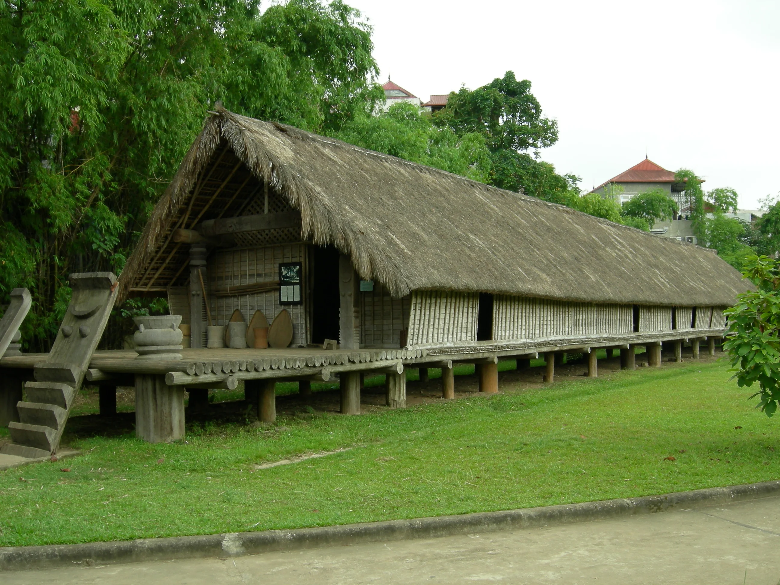 Full-scale Bahnar communal Rong stilt house in the outdoor architectural garden of Hanoi Museum of Ethnology